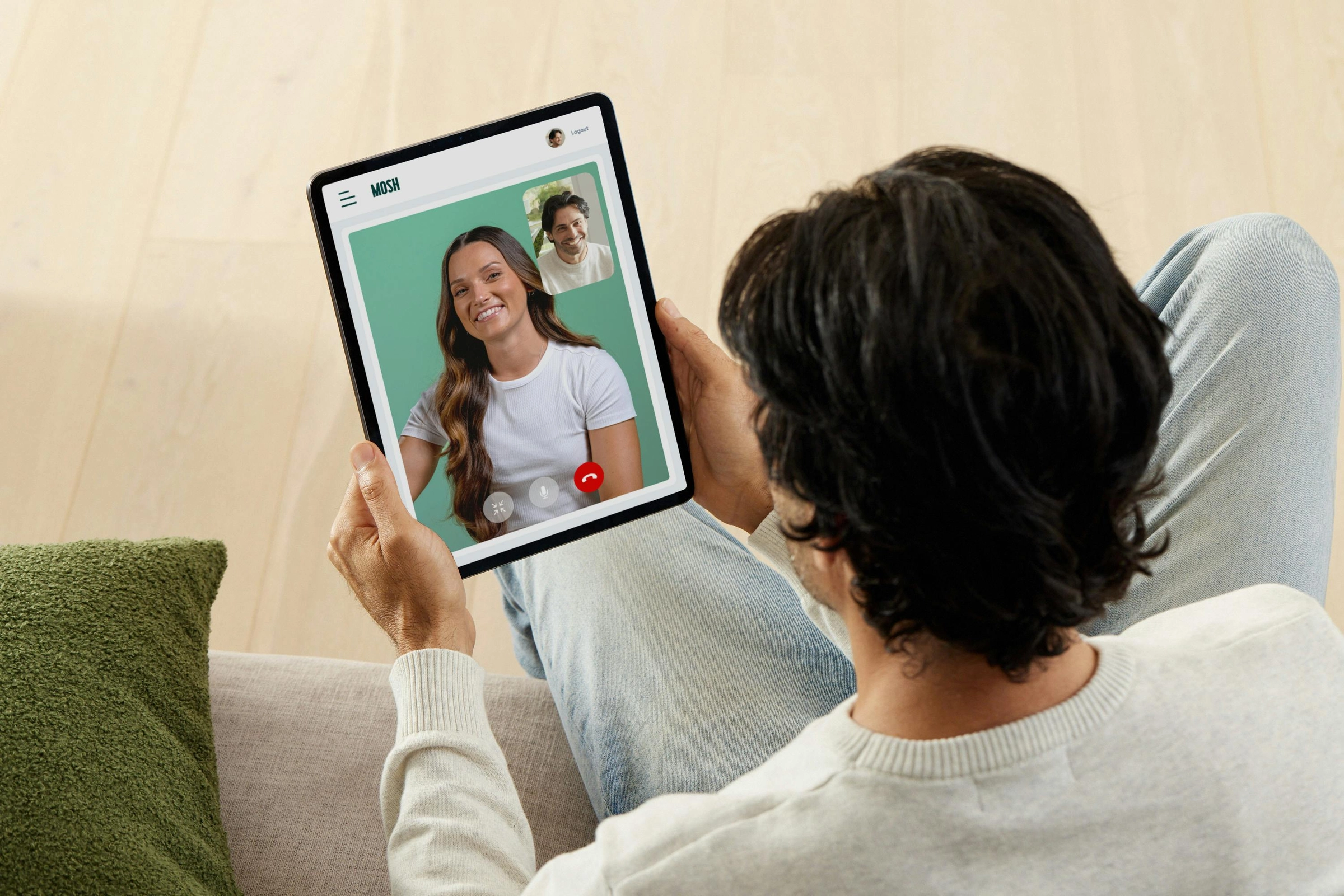 Man on a video consult with a practitioner on a tablet